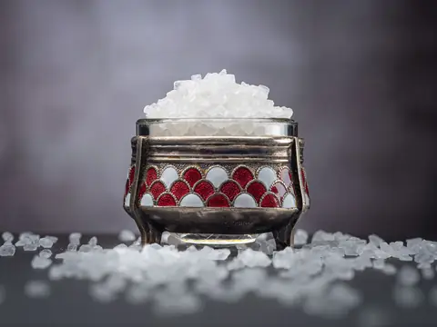 Coarse salt heaped in a small metal pot